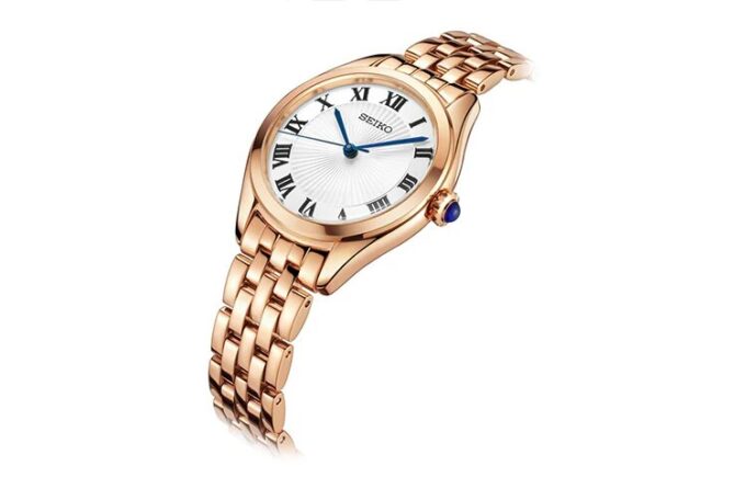 Orologio al quarzo alla moda con quadrante blu e bianco, cinturino in oro rosa, impermeabile fino a 5 ATM